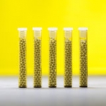 five-small-glass-tubes-homeopathy-globules-yellow-background-55506042